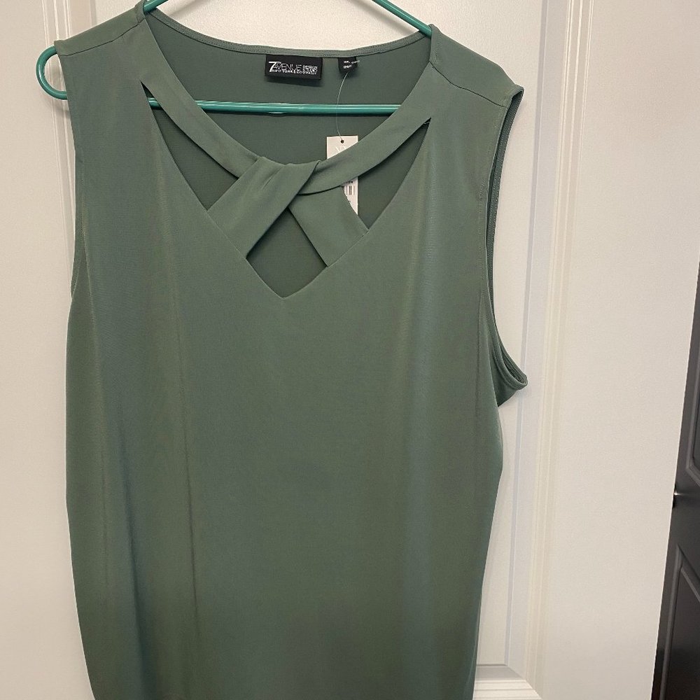 Green top criss cross neck. No Sleeves.